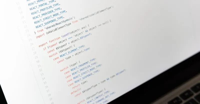 Close-up of JavaScript code on a laptop screen, showcasing programming in progress.