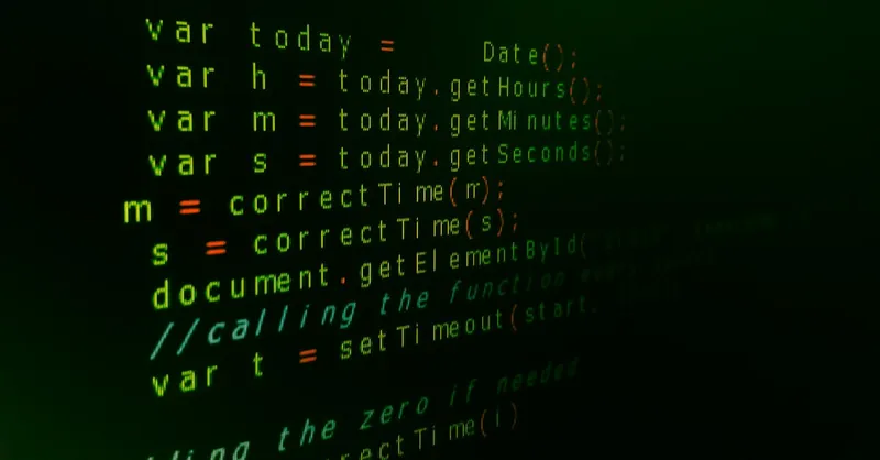 Close-up of JavaScript code on a computer screen with green text highlighting syntax.