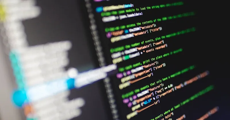 Close-up of a computer screen displaying colorful programming code in JavaScript.