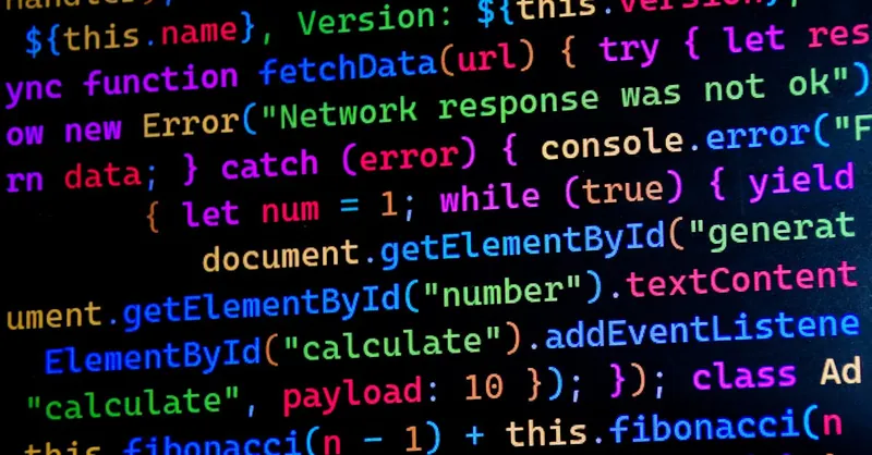 Close-up of colorful JavaScript code displayed on a computer monitor, ideal for tech-themed projects.
