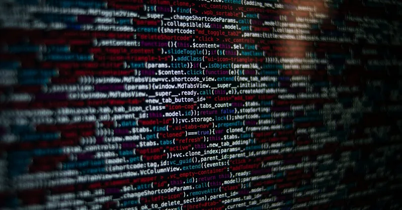 Detailed image of computer source code displayed on a screen, showcasing web development elements.