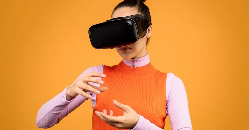 A woman engages with virtual reality using a VR headset, expressing surprise and immersion.