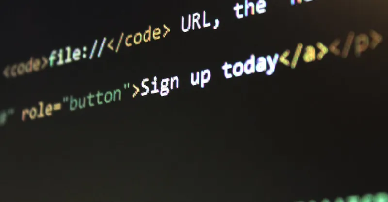 Detailed view of HTML and CSS code on a computer screen, concept of programming.