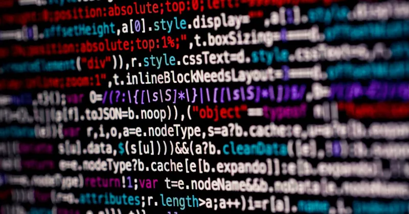Close-up of multicolored code on a computer screen, highlighting programming.